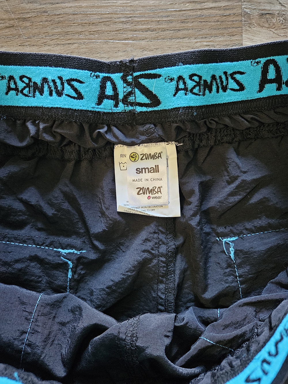 Zumba Fitness Men's Black Zip It Convertible Cargo Pants With Teal Embroidery - Picture 9 of 14